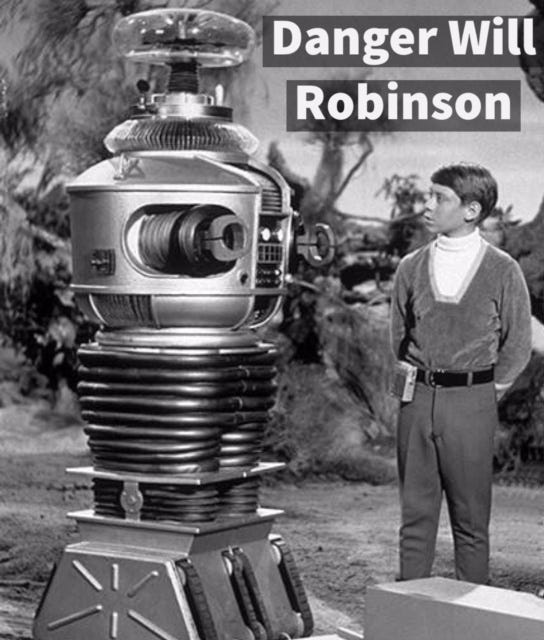 Will Robinson (Billy Mumy) and the robot (voiced by
	    Dick Tufeld) in Lost in Space (1965-1968).